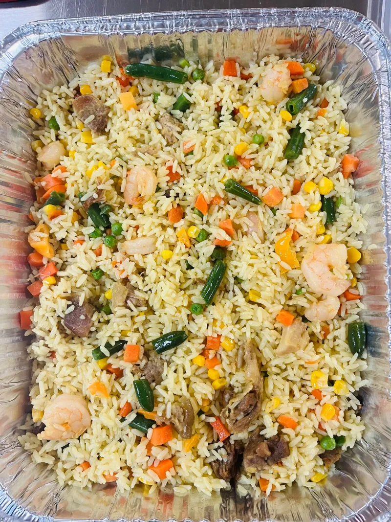 Freshly prepared Nigerian fried rice for catering in Peterborough